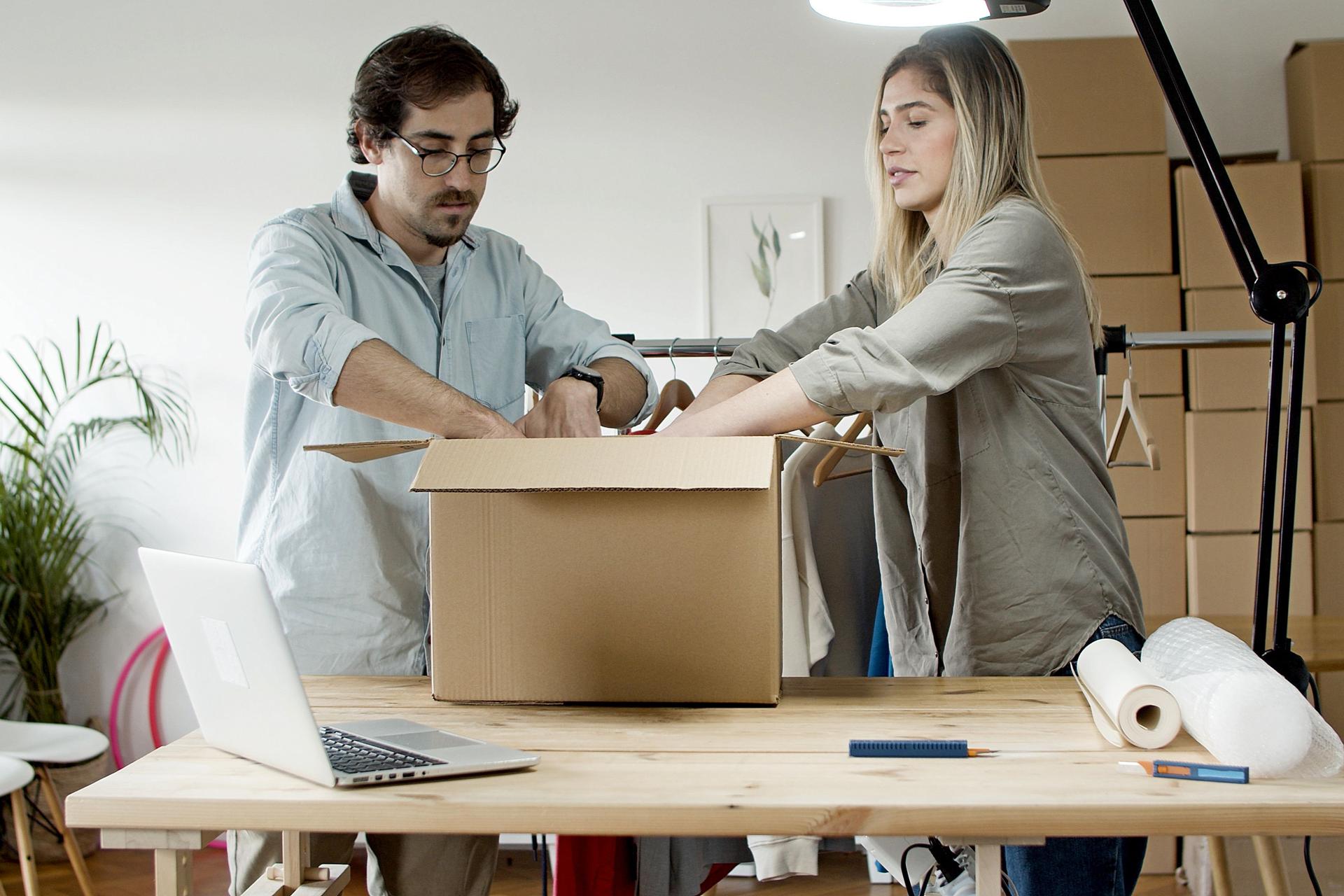E-commerce operations with laptop and shipping packages